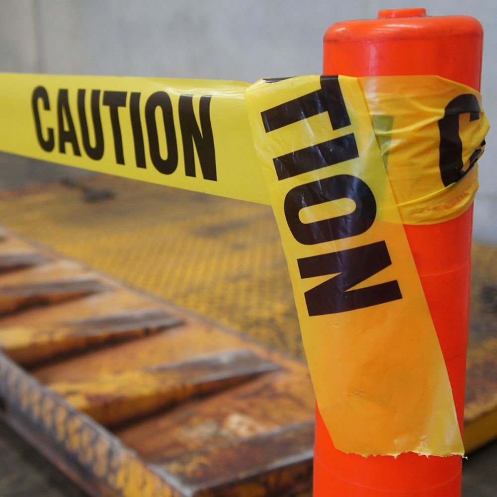 Yellow caution barrier tape 75mm x 100m CAUTION print — warehouse hazard warning — SafeMark Supplies